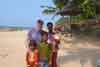 Feb 2011 Kovalam India. With the beach seller and his family